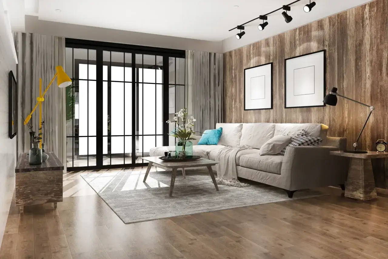Soggiorno moderno con divano beige, tavolino in legno, tappeto grigio e parete effetto legno. Un esempio di come arredare casa con poco, con stile e funzionalità.